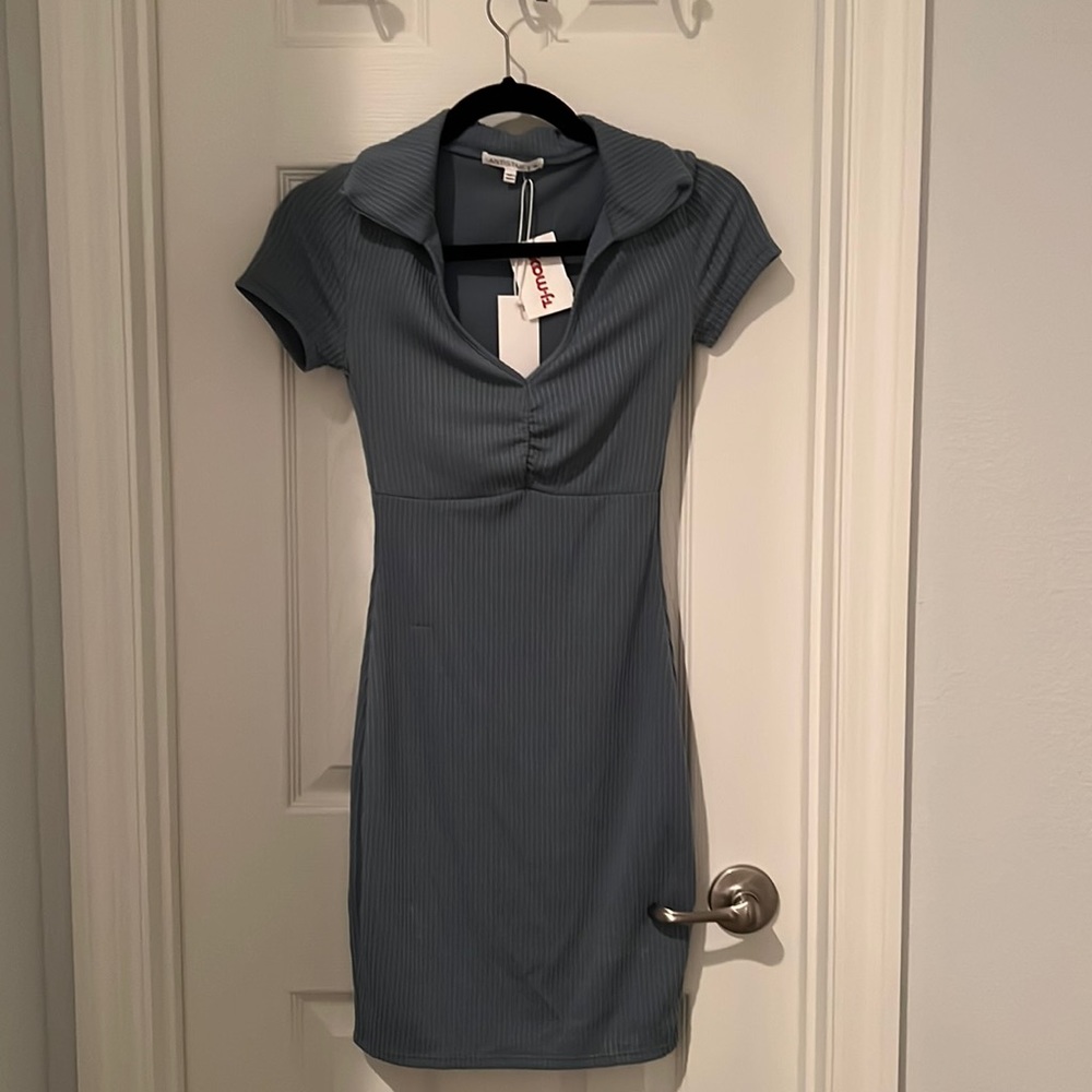 The is a grey-blue ribbed dress with collar in perfect condition and brand new